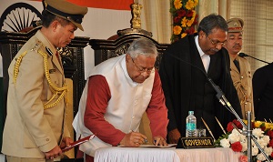 The Governor of Arunachal Pradesh Padmanabha Balakrishna Acharya signing oath paper in presence of Hon�ble Chief Justice of Gauhati High Court Mr. Justice Shri Ajit Singh in the Darbar Hall of Raj Bhavan, Itanagar on Itanagar on 28th January 2017.